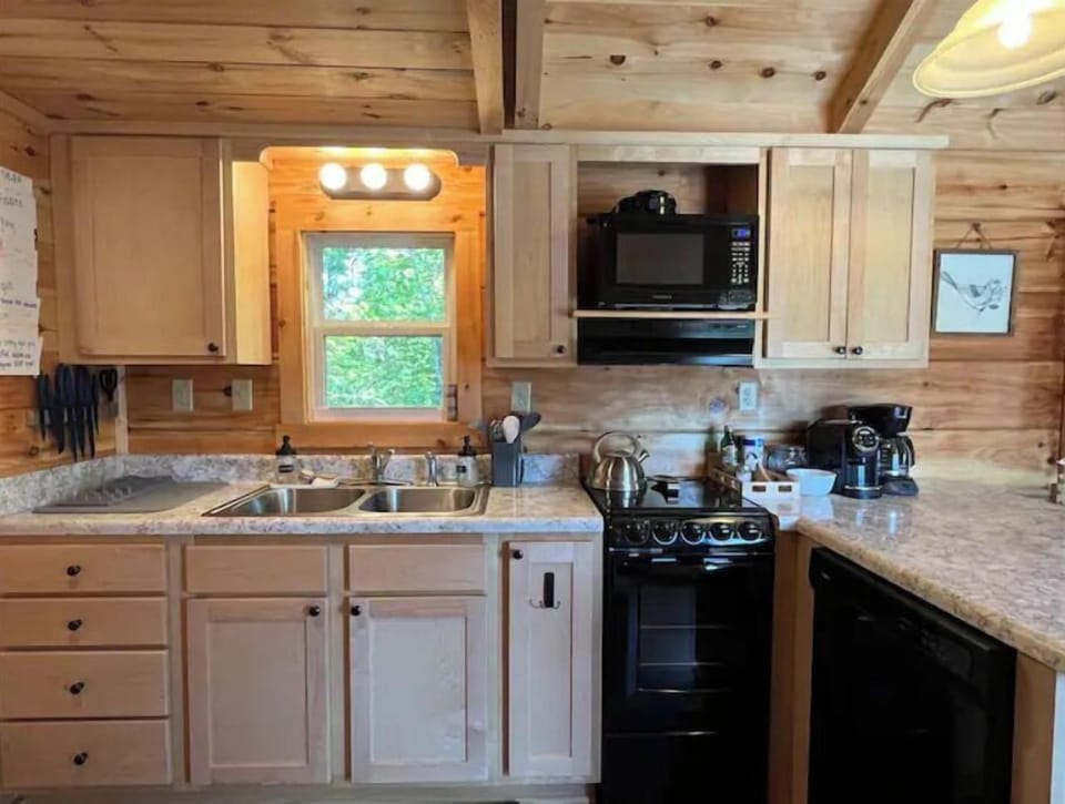 The kitchen is fully stocked with everything you need to cook and eat together.