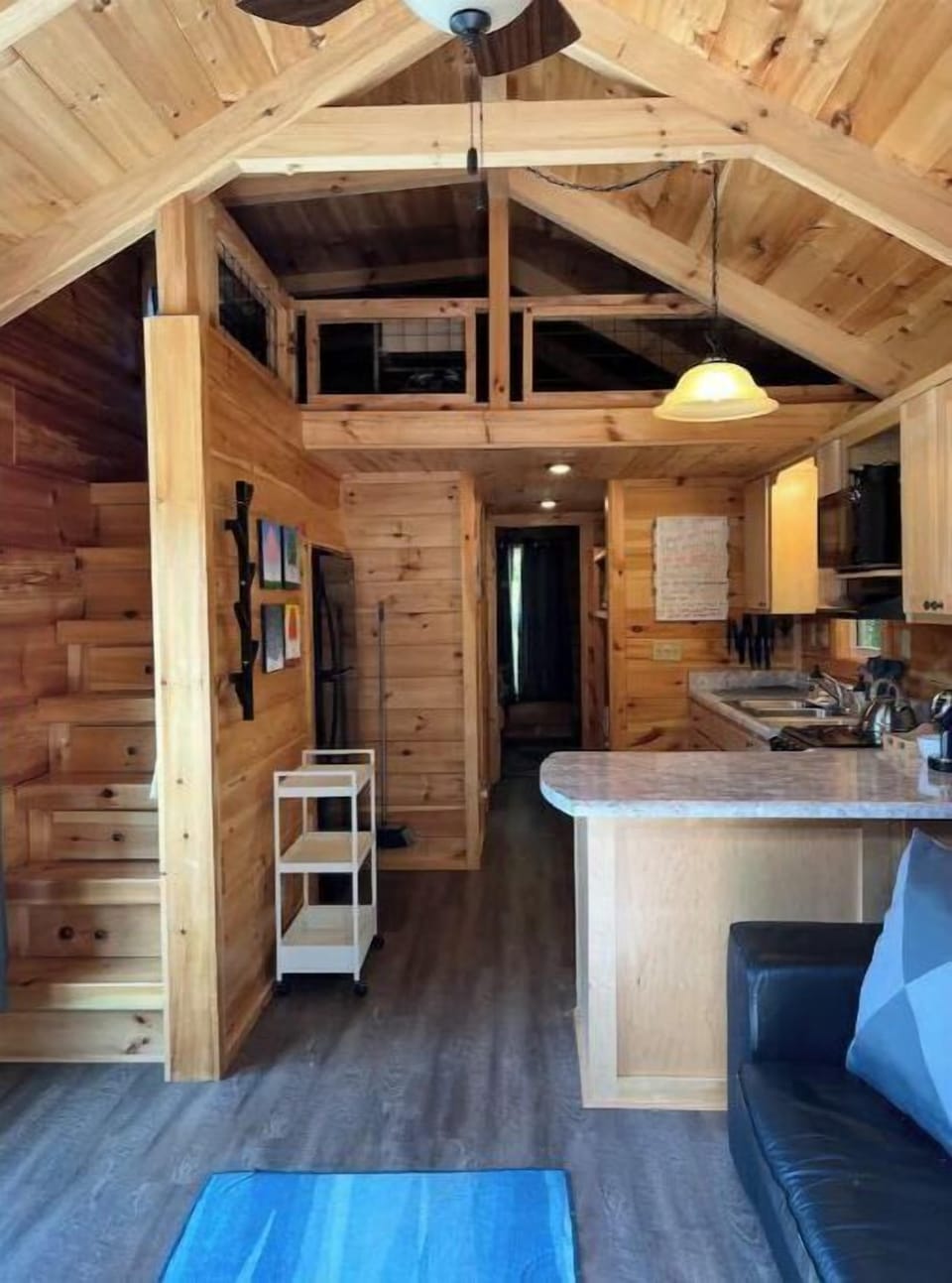 The living room opens into the full kitchen.