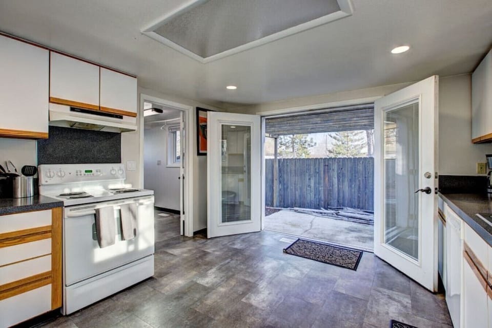 Opulent kitchen with double doors to the patio