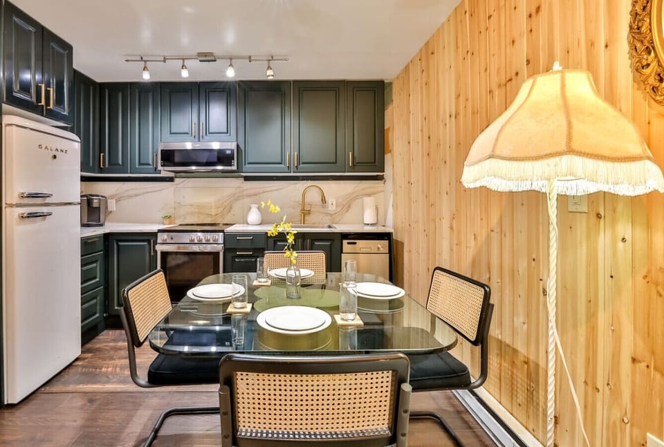 Fully Stocked Kitchen, with Dishwasher, Fridge/Freezer, Toaster, Coffee Maker, Stove, Microwave, and Tea Kettle.