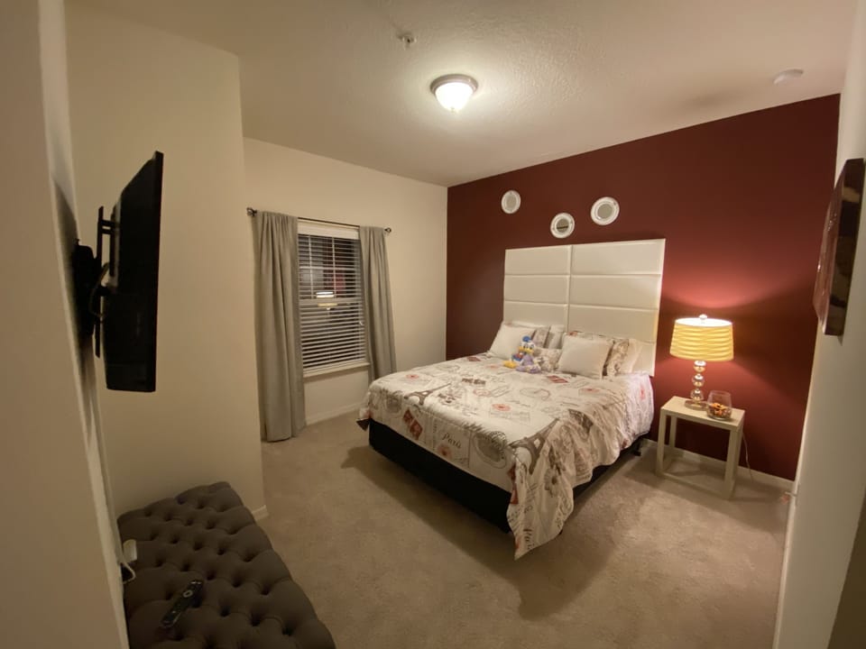 View of upstairs bedroom with full size bed and TV