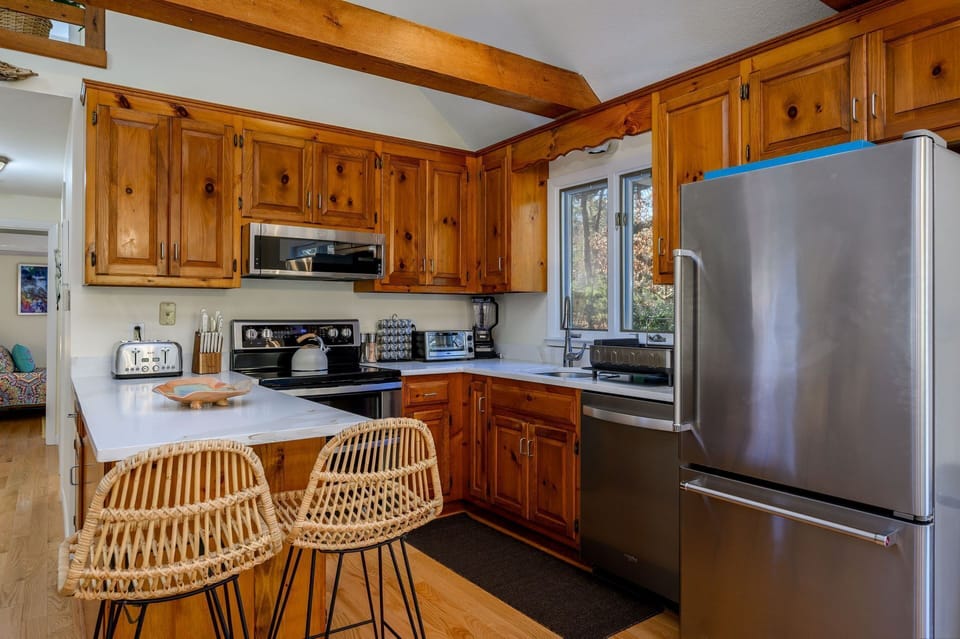 Well-appointed kitchen with modern appliances and new countertop