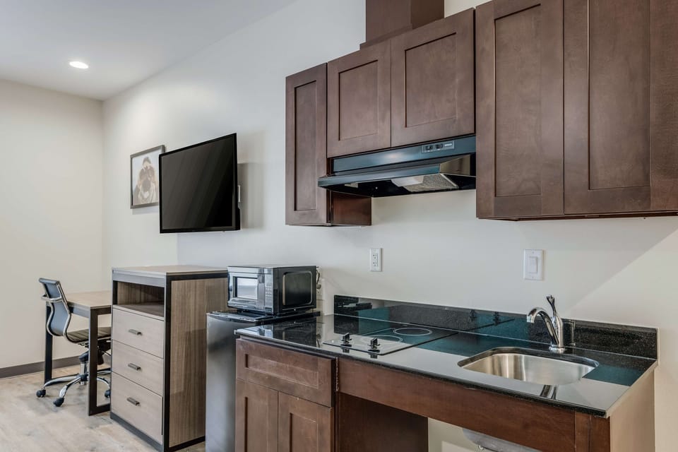 Whip up quick bites with sink, cooktop, and mini-fridge.