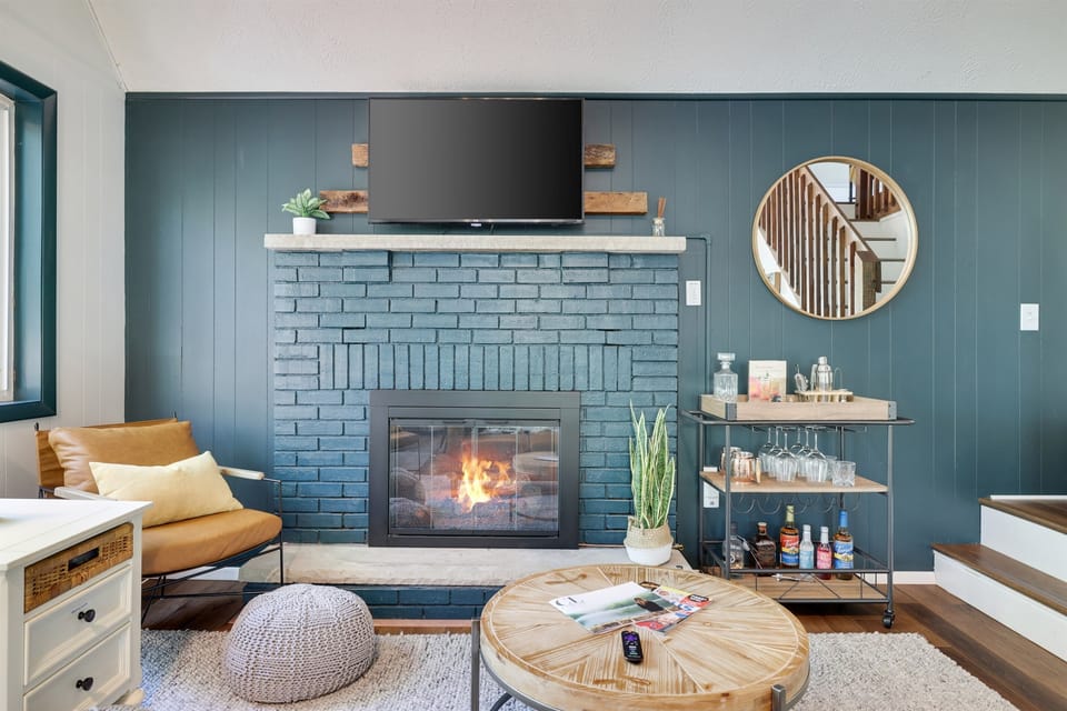Living room has propane fireplace and smart tv. 