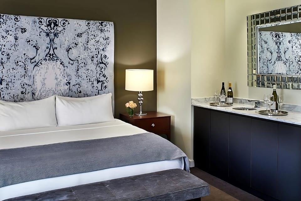 Relax in a sun-washed king room with elegant lounge seating.