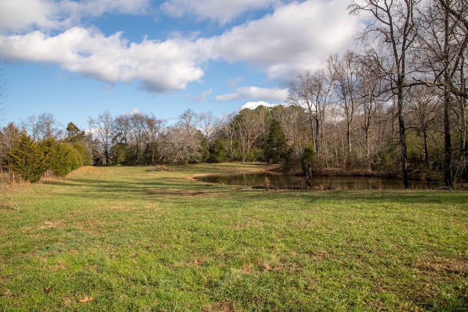 Unwind by the serene fishing pond—a perfect spot for fishing and nature enthusiasts alike