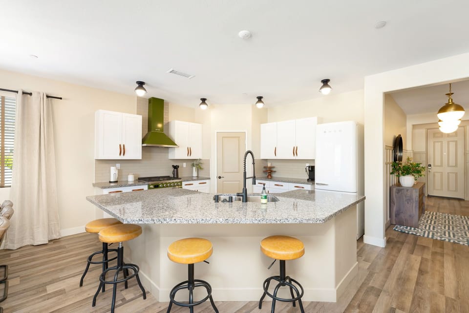 4 barstools on the large kitchen island