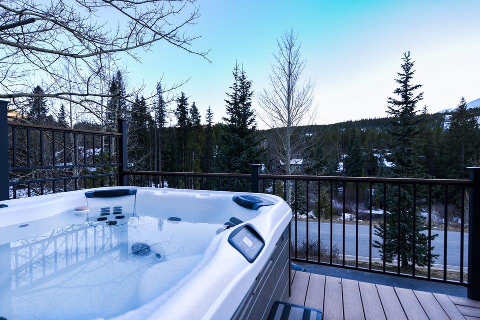 Hot Tub with a View - Large deck with a hot tub and a view.