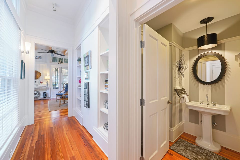 HALF BATH OFF OF LIVING AREAS DOWN