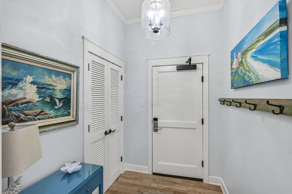 Front door entry way has closet with beach supplies available.
