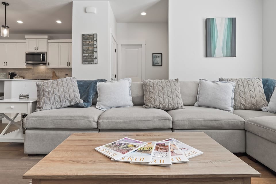 Living room with local Boise Art and our main floor half bath with pocket door.