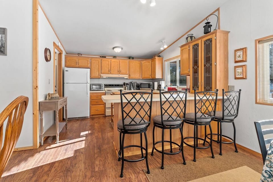 Engage in culinary creativity and lively conversations in the open kitchen with a central island, seamlessly blending the joy of cooking with a sociable atmosphere.