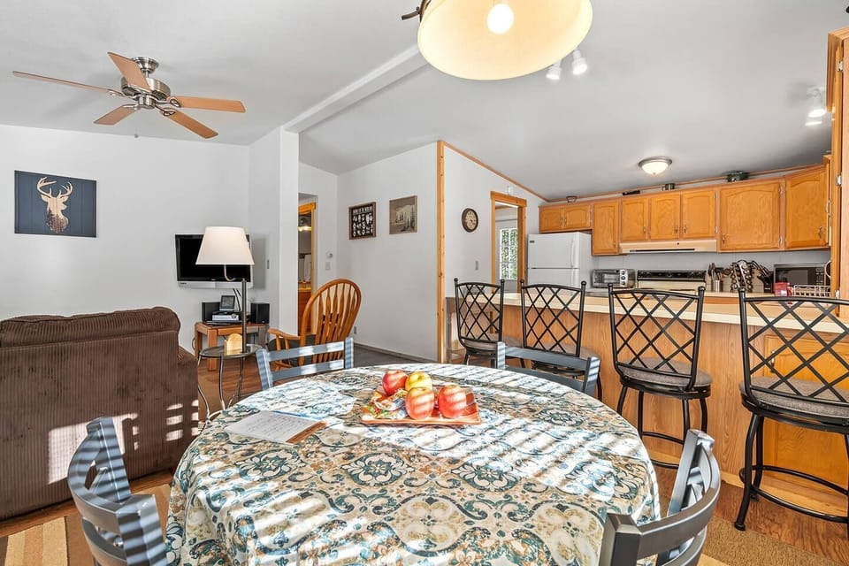 Savor your meals in style at the cabin's dining area, featuring a charming island that adds a touch of elegance to your culinary experiences in the heart of Valley Creek.