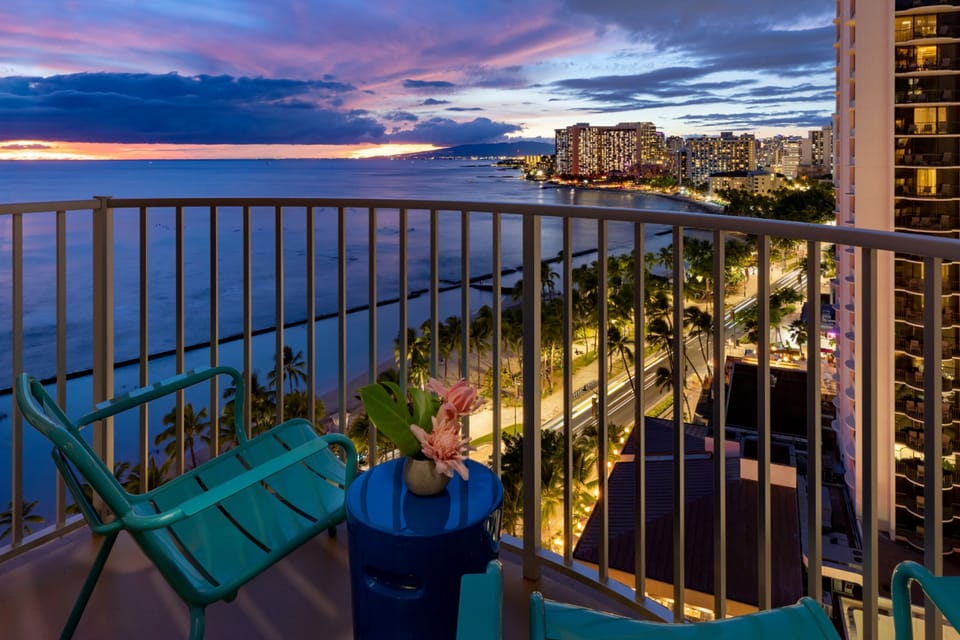 Savor sunset cocktails on the balcony with sweeping ocean views.