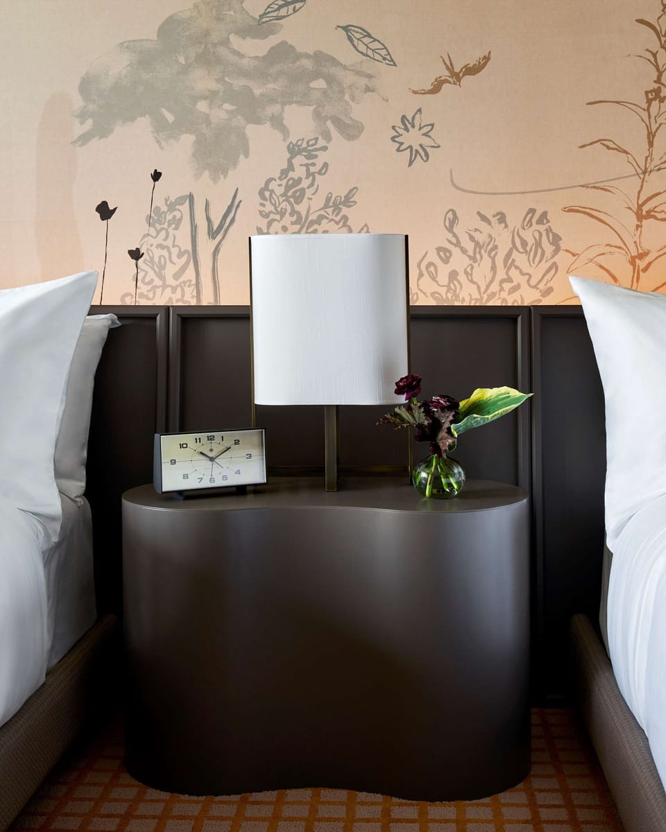Drift off easily with soft lighting and thoughtful bedside touches.