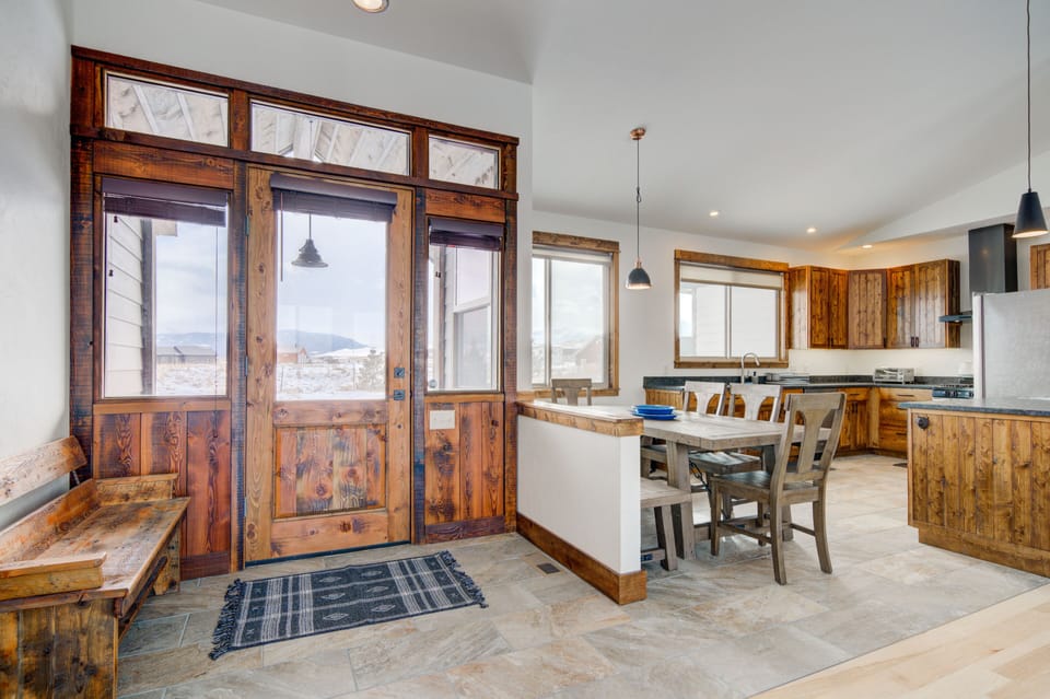 The home's main entry features custom reclaimed millwork and wood.