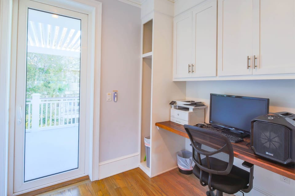 There is a desk & workspace near the kitchen.