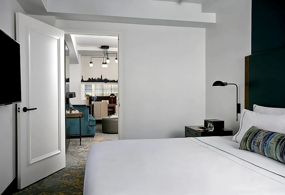 Wake up refreshed in a serene suite with thoughtful nightstands.