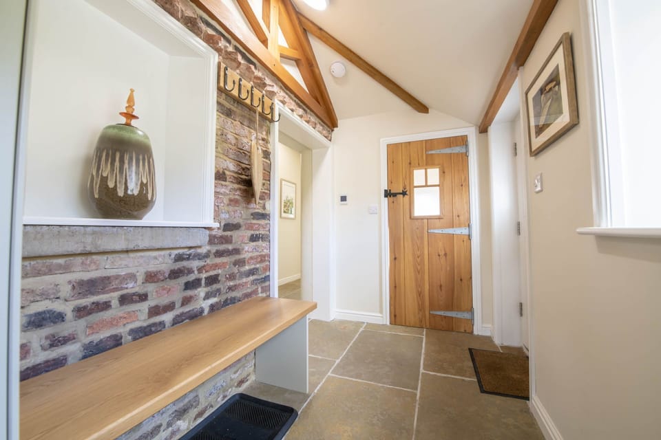 Ground floor: Hallway leading to cloakroom with WC