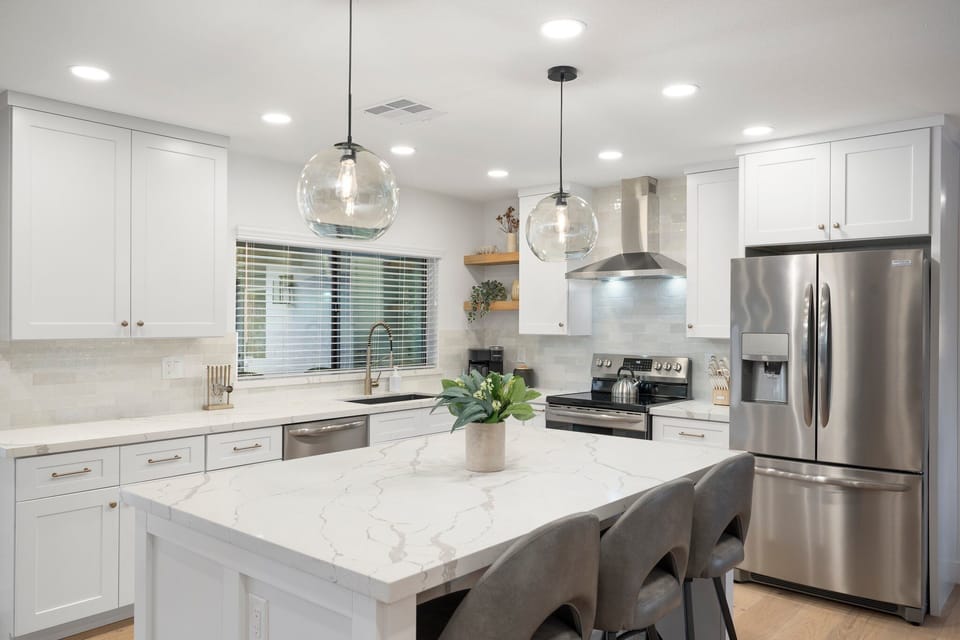 3 barstools in the kitchen. 