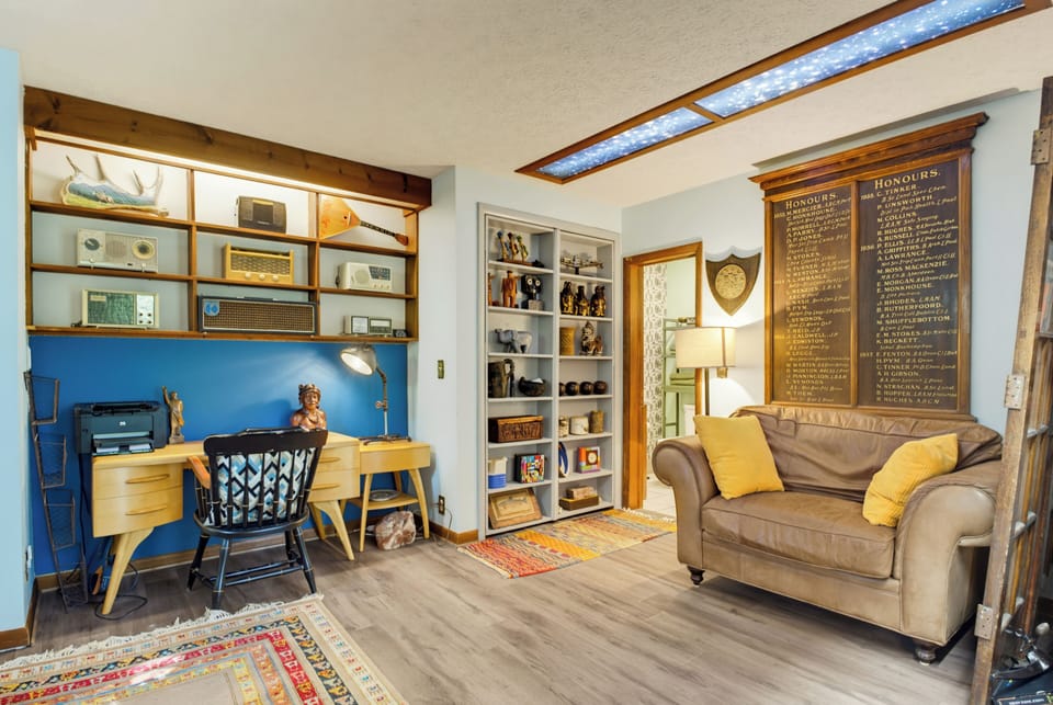 Cozy lounge and workspace with vintage charm and warm, inviting style