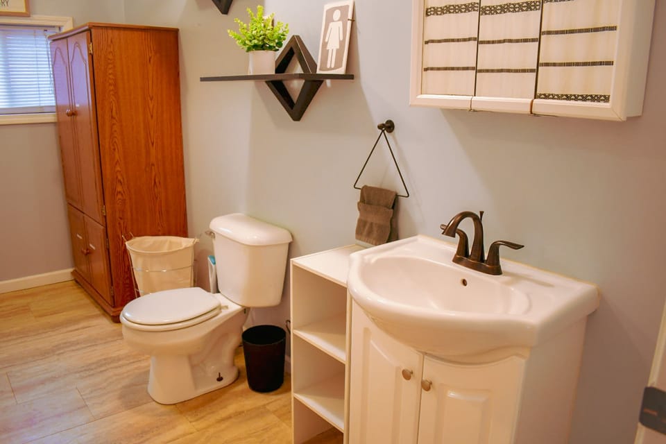 Full bathroom upstairs with tub shower