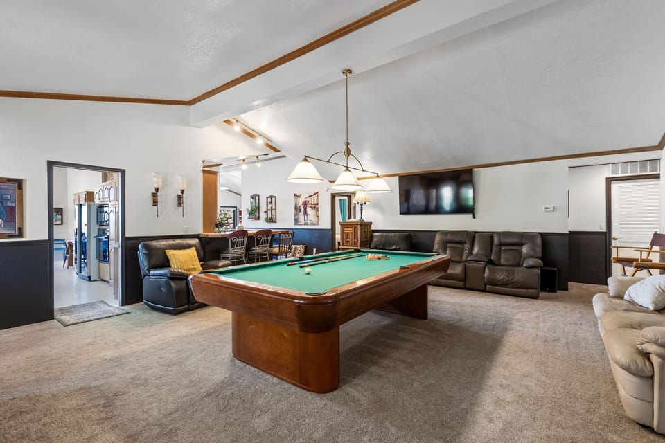 Billiard room looking into the kitchen and bar.