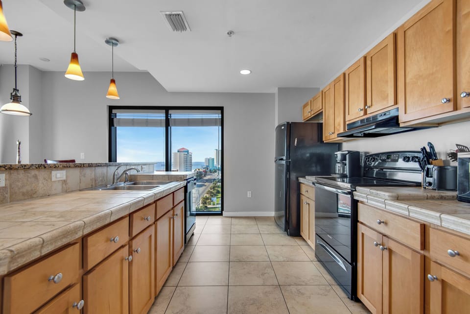Kitchen - Prepare feasts with ease in this elegant gourmet kitchen, outfitted with top-notch appliances, and a full suite of cooking essentials.