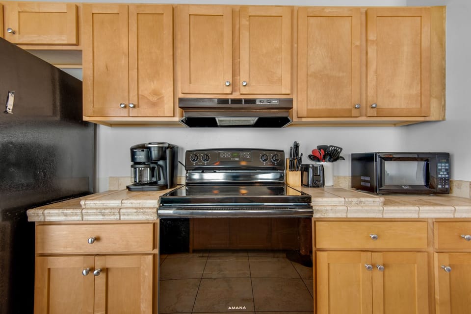 Kitchen - Prepare feasts with ease in this elegant gourmet kitchen, outfitted with top-notch appliances, and a full suite of cooking essentials.