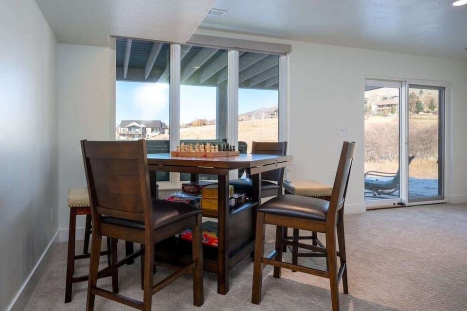 Play chess or your favorite board game at the table in the second living area/game room.  There is easy access from the game room to the covered lower level patio. Don't miss those stunning mountain views!