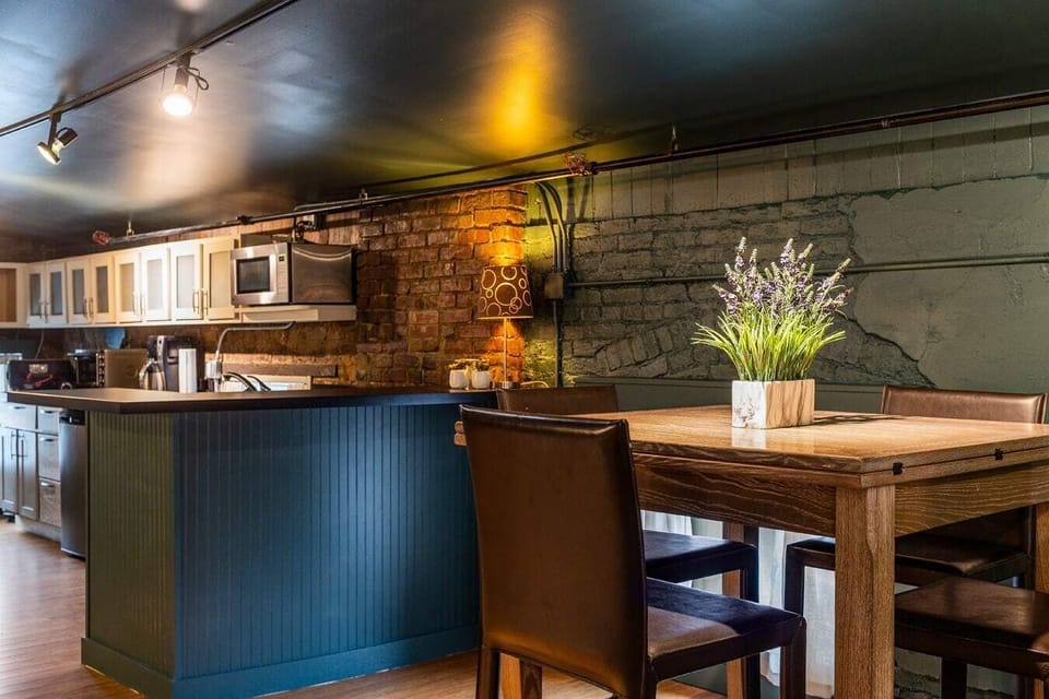 Kitchenette and dining area—perfect for light meals and morning coffee before exploring NuLu.