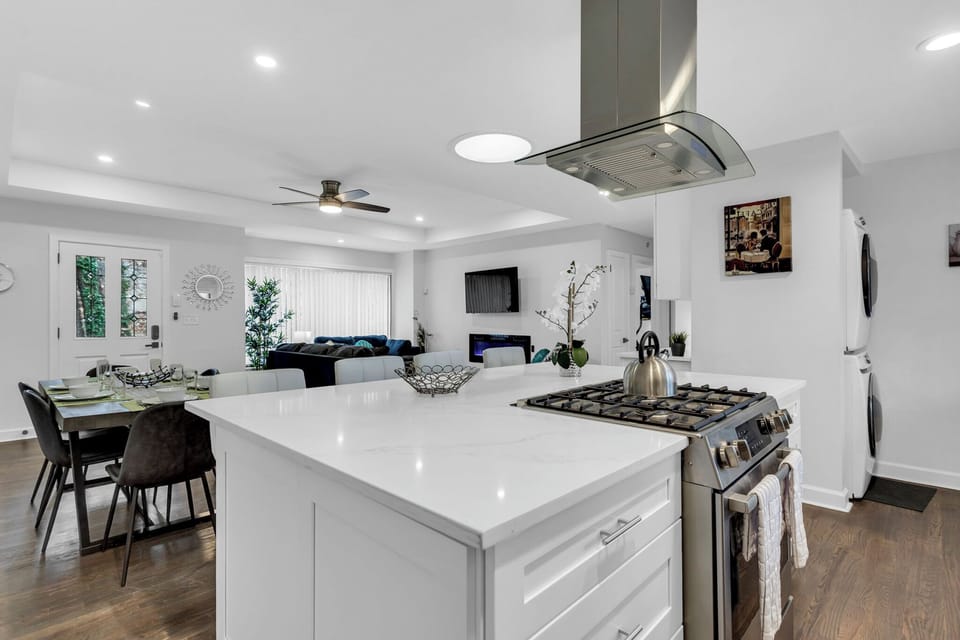 Kitchen Area with island, stainless-steel appliances, washer/dryer - Main House