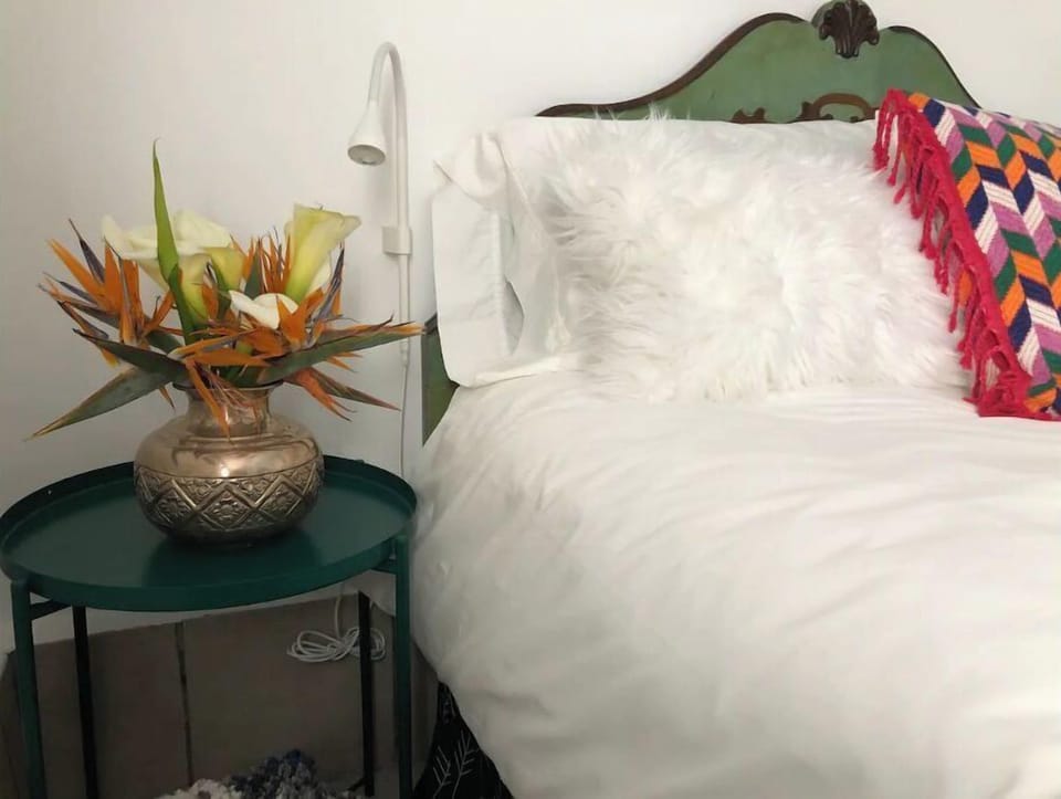 Out bed is a cloud of comfort. Crispy white linens and mayan textiles make it. 