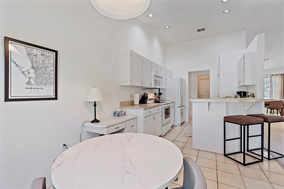 Breakfast nook flows seamlessly from the kitchen. Perfect for a cup of coffee or a good puzzle on a rainy day!