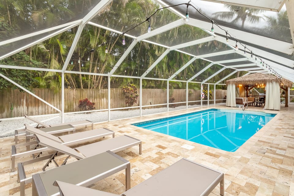 The sunny lounge area contains 4 chaise loungers and 2 coffee tables.
