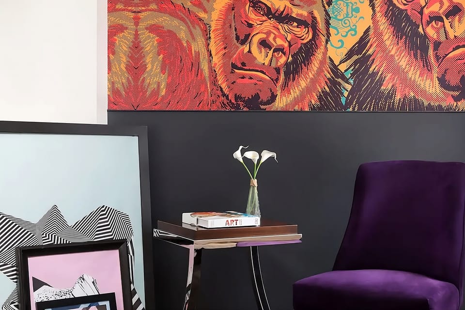 Sink into a cozy chair surrounded by bold, gallery-style art.