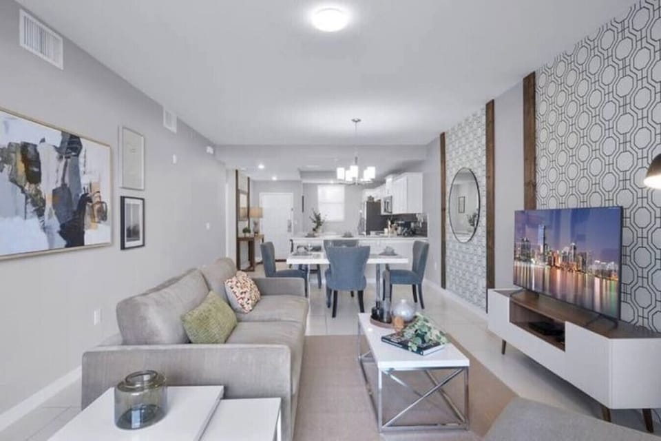 Living Room with 55" Smart TV#Disney #Parks #kingdom #springs #StoreyLake #Apartment #Vacation #Rental #waterpark #Kissimmee #Orlando #universal #citywalk