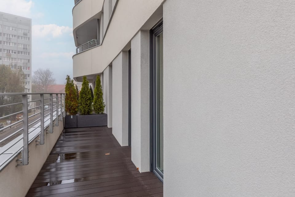 Another view of the balcony showing its wooden flooring and the relaxing vibe.