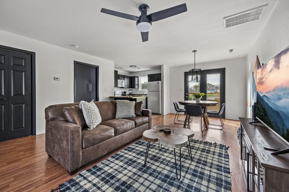 This cozy living room sofa converts into a comfy sleeper🛋☁️ making it the perfect addition to our cabin for more guest!s