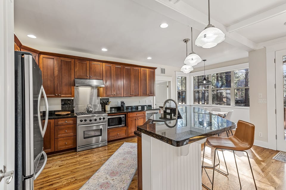 Kitchen with 3 bar stools at island