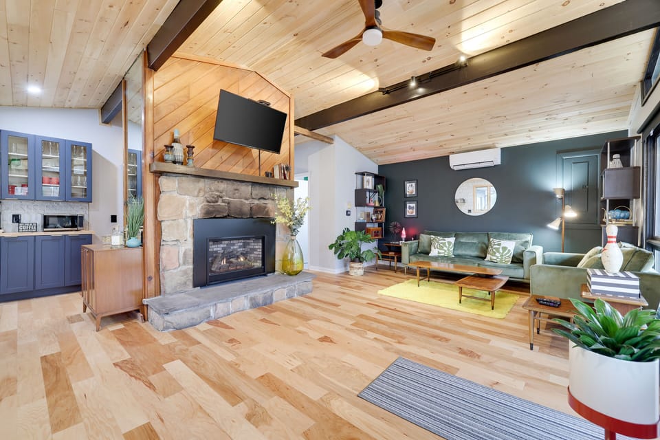 Open floorplan w central fireplace provides easy flow throughout all spaces