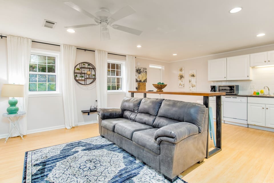 Open floor plan that connects the kitchen to the living room. Cozy sofa that pulls out into an extra bed.