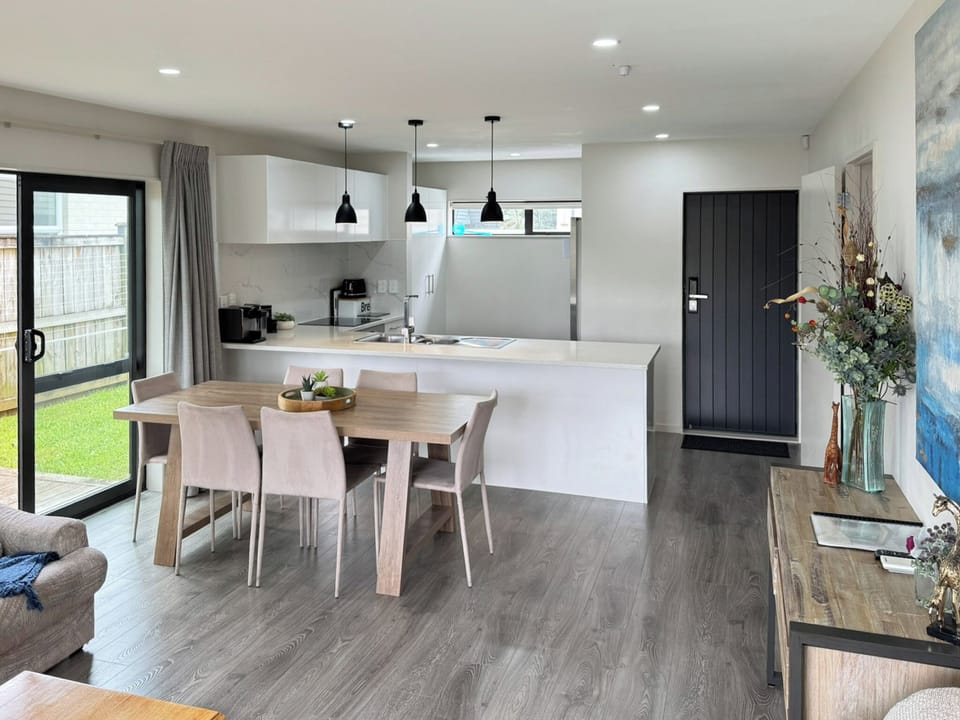 Open-plan dining and kitchen area with easy flow from the lounge.