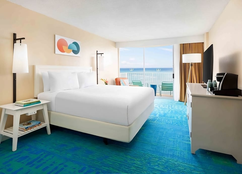 Sip morning coffee while gazing out at endless ocean.