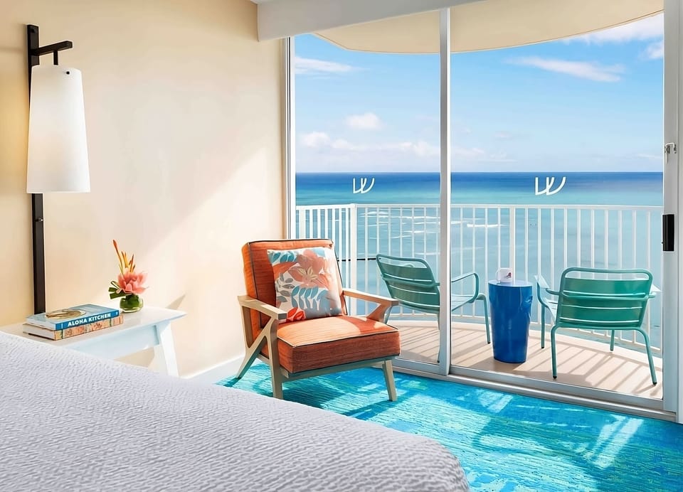 Wake up to ocean views from your sunlit bed.