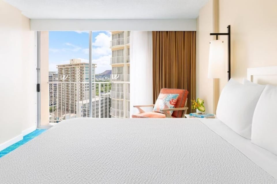 Soak in skyline views from crisp, hotel-style linens.