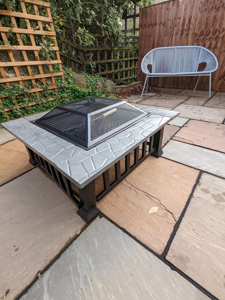 South facing patio area with fire pit.