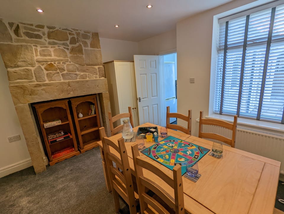 Dining table, comfortably seating six for group dining and/or board games.