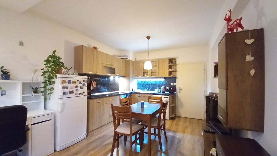 A fully equipped kitchen with spices and some ingredients in the drawers