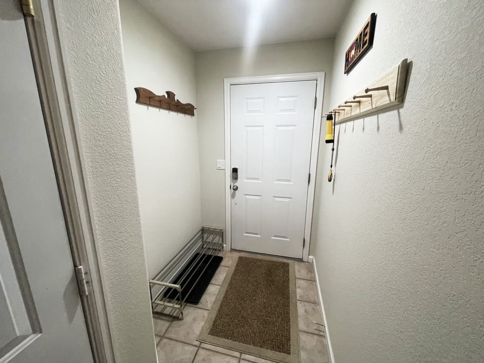 Entryway with room for shoes and coats.